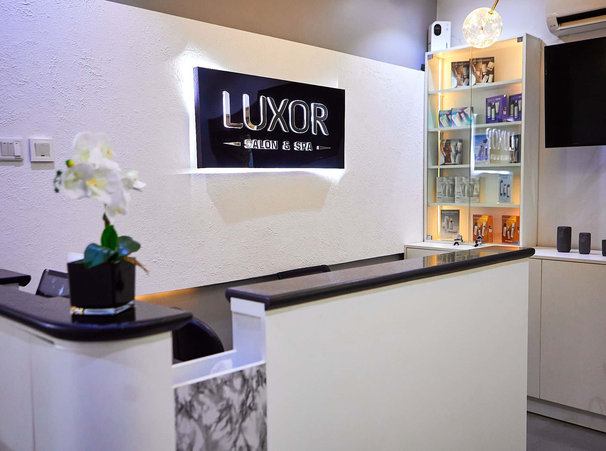 Luxor Salon & Spa reception with product display