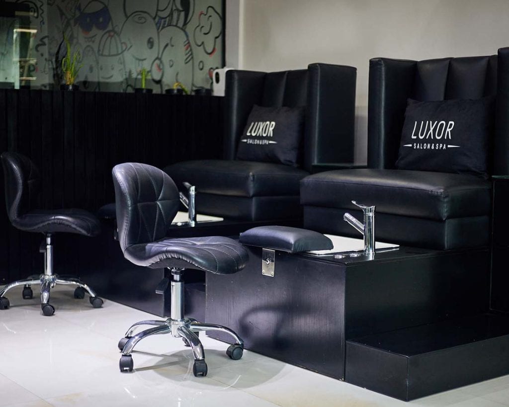 Black leather salon pedicure chairs and stools