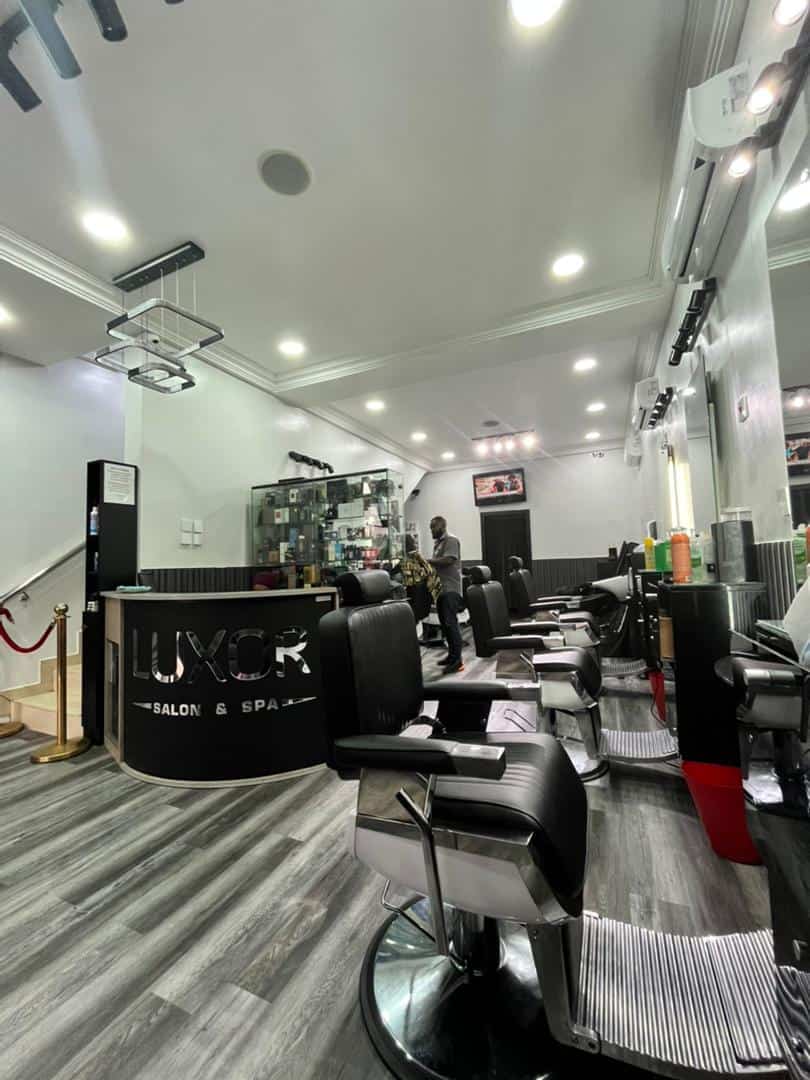 Modern hair salon interior with black styling chairs