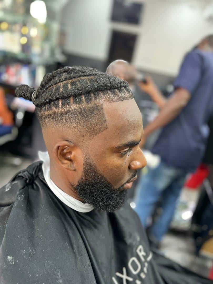 Man with braided top fade haircut in barbershop