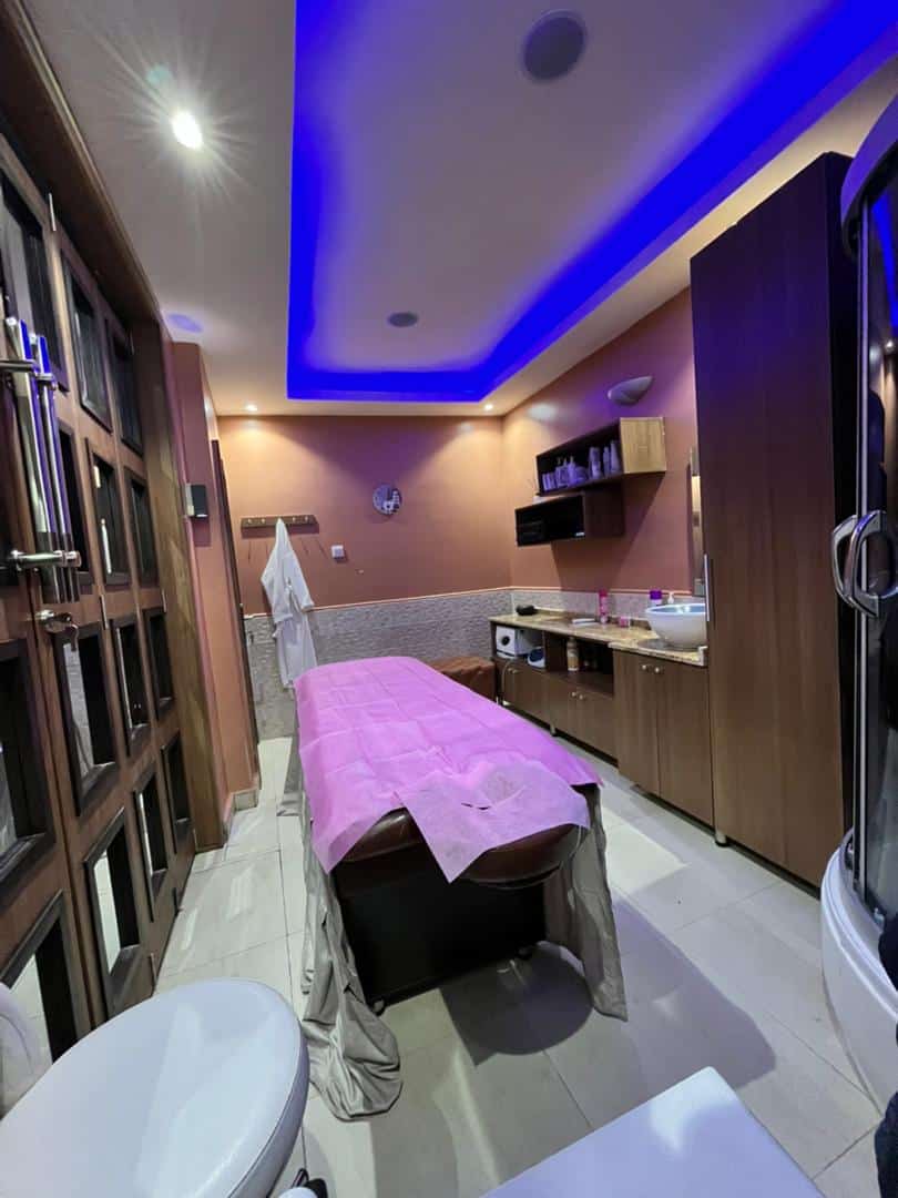 Modern spa treatment room with massage table