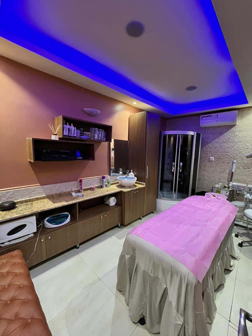 Modern spa treatment room with massage table