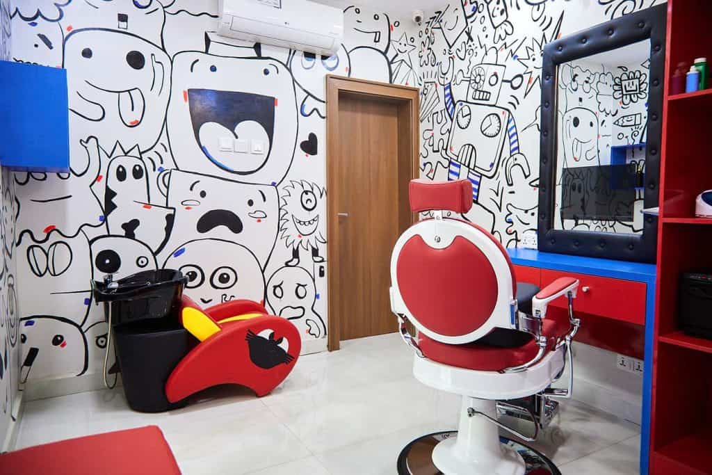 Colourful children's hair salon with cartoon mural walls