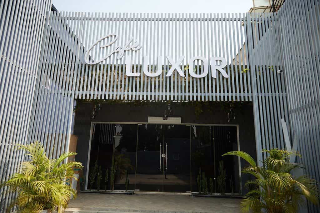 Modern entrance of Cafe Luxorii with glass doors