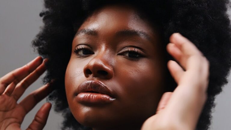 Close-up of woman with natural afro hairstyle