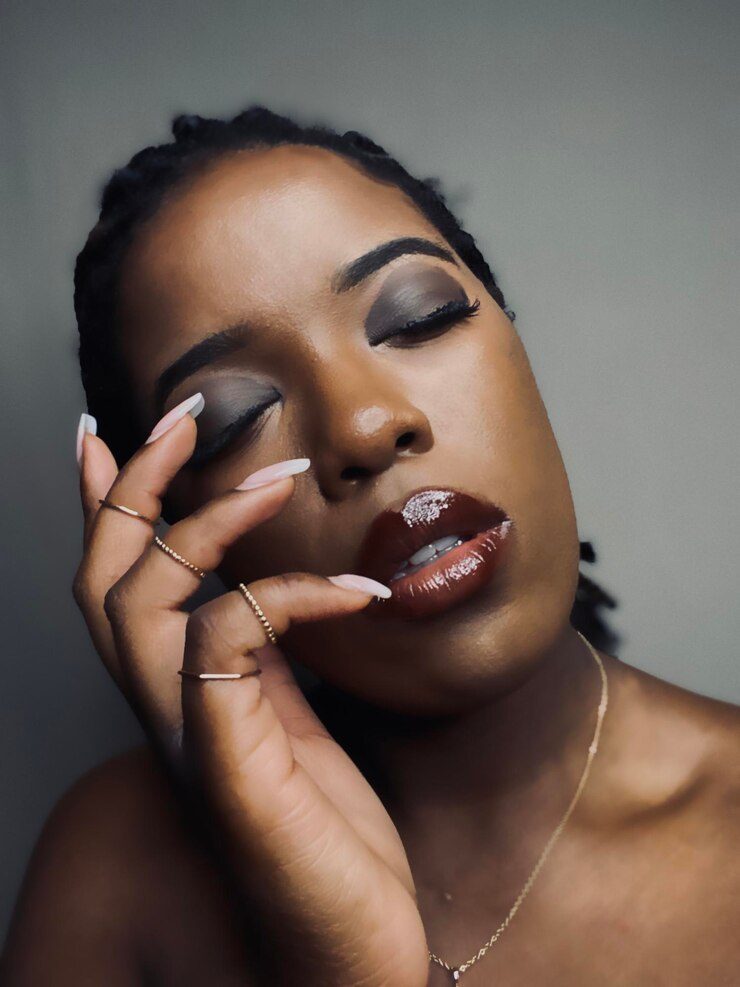 Close-up portrait of woman with glossy lips