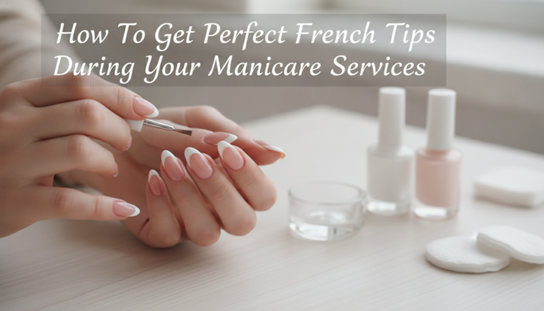 Hands with French manicure being painted with brush