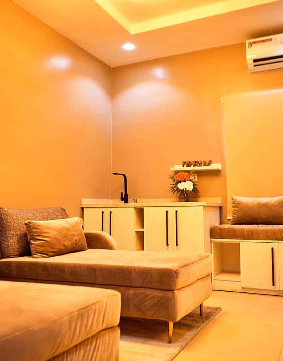 Modern orange lounge with sofa and wall art